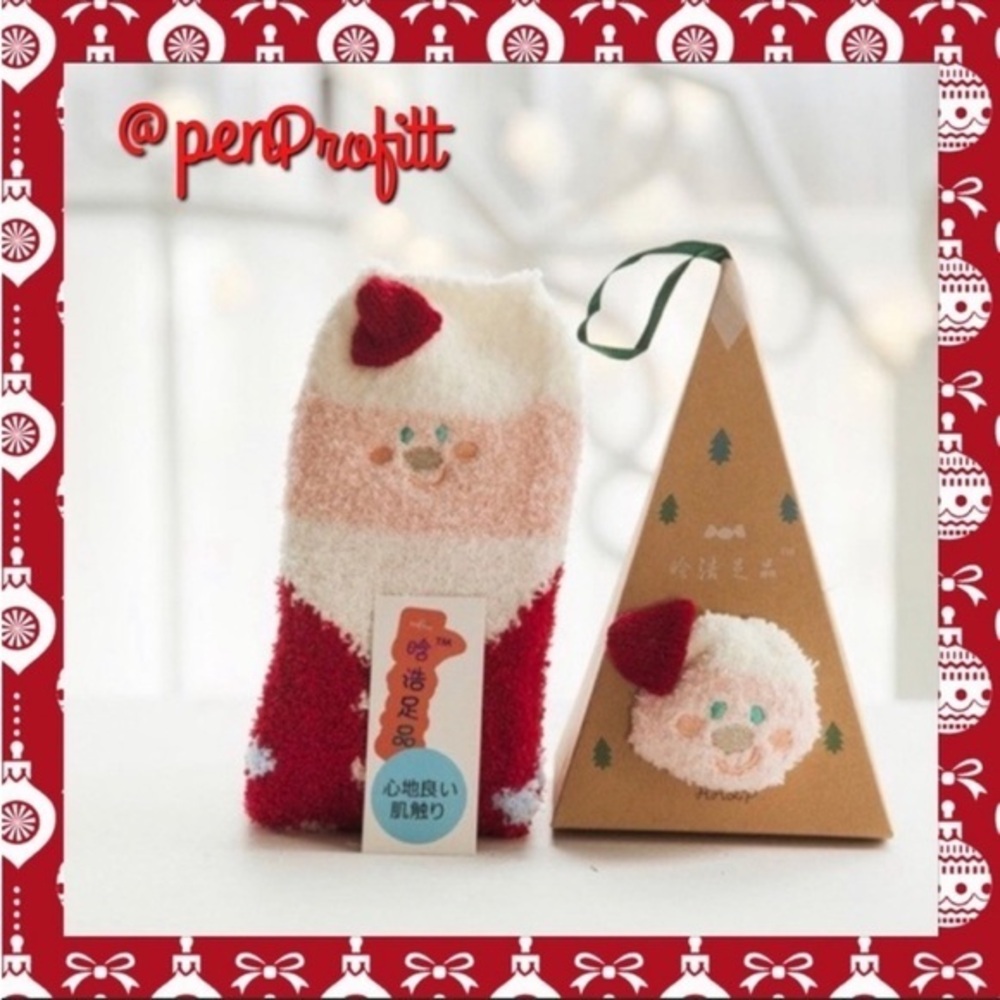 Santa fuzzy socks in ornament box